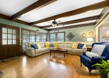 A bright and stylish living room featuring comfortable seating and natural lighting.